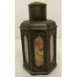 A Chinese pewter 7 sided tea caddy with reverse painted glass panelled sides.