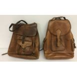 2 vintage brown leather rucksack bags. Both with front buckle and drawstring fastening.