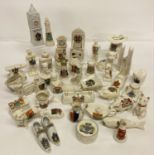 A quantity of assorted vintage novelty shaped crested china.
