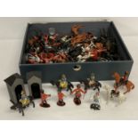 A quantity of assorted vintage plastic soldiers in red, black and white, some marked Charbens.
