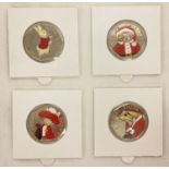 A set of 4 Beatrix Potter 2017 50p coins with coloured Christmas decals.