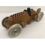 A painted cast metal model car with moving pistons.