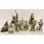 8 ceramic and resin figurines to include Country Artists, Dresden and Capodimonte.
