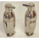 A pair of novelty penguin shaped cocktail shakers.