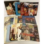 A collection of 18 vintage LP records to include Elvis, The Everly Brothers, Adam Faith and Queen.