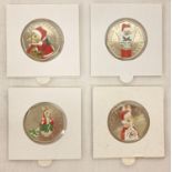 A set of 4 2018 Beatrix Potter 50p coins with coloured Christmas decals.