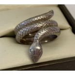 A silver serpent ring with scale decoration throughout.