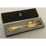 A 1973 boxed silver gilt Georg Jensen spoon with enamelled sunflower designed handle.