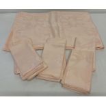A large peach linen jacquard table cloth and 12 matching napkins.