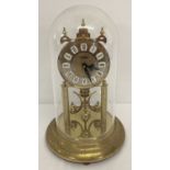 A vintage rotating torsion pendulum clock by Haller.