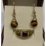 A 9ct gold tigers eye and diamond dress ring together with a pair of tigers eye drop earrings.