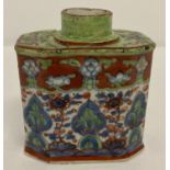 An antique ceramic Chinese export hand painted tea caddy, in green, blue and brown tones.