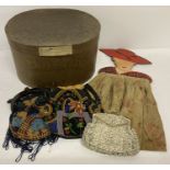 A collection of vintage handbags to include beaded and wooden ladies head shaped wooden handled.