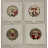 A set of 4 Beatrix Potter 2017 50p coins with coloured Christmas decals.