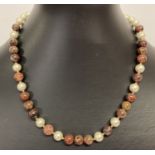 A 16" Swarovski pearl and brecciated jasper beaded necklace with 9ct gold clasp & spacer beads.