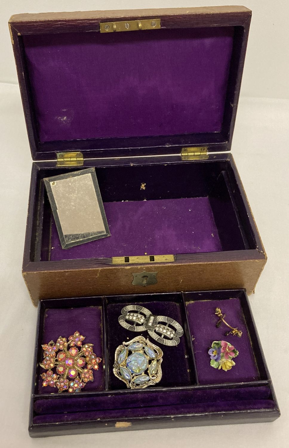 A vintage purple velvet and silk lined jewellery box and contents.