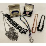 A collection of vintage and modern costume jewellery.