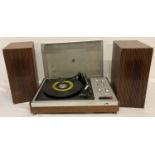 A vintage HMV 2452 record turntable with original wooden cased speakers.