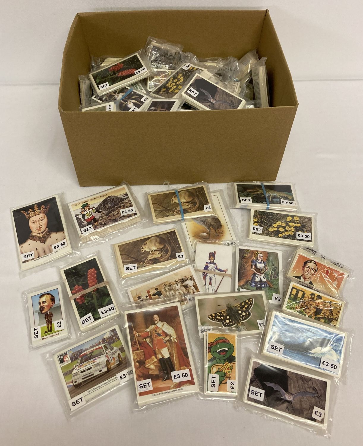 A box of assorted collectors card sets, to include tea, cigarette, Chocolate and football cards.
