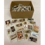 A box of assorted collectors card sets, to include tea, cigarette, Chocolate and football cards.