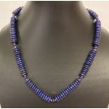 An 18" costume jewellery necklace made with lapis lazuli disc shaped beads.