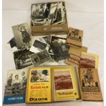 A box of vintage film negatives together with a box of black and white vintage photographs.