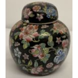 A famille noire lidded ginger jar with floral decoration.