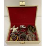 A vintage jewellery box and contents. To include costume jewellery bracelets, bangles and rings.