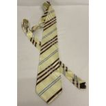 A Burberry neck tie in classic check pattern. Named Burberry lining with Burberry embroidered logo.