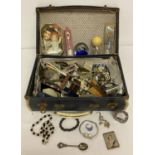 A small vintage suitcase containing a quantity of assorted misc. items.