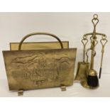 A vintage brass magazine rack with embossed ship decoration together with a vintage brass companion