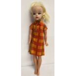 A vintage 1968 Sindy doll in a original 1968 Summery Days 12S55 MIE check dress.