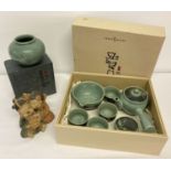 A collection of vintage Korean ceramics. A boxed celadon bulbous vase with crackle glaze.