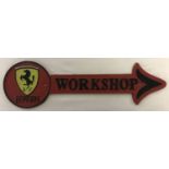 A painted cast metal Ferrari workshop arrow wall hanging sign.