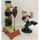 2 painted cast metal figures of Popeye, boxing.
