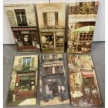 A collection of 6 modern wooden framed canvas prints depicting Parisian shop fronts.