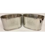 A pair of large Bollinger Champagne buckets with engraved details to sides.