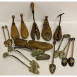 A quantity of vintage wooden and metal shoe lasts and stretchers.