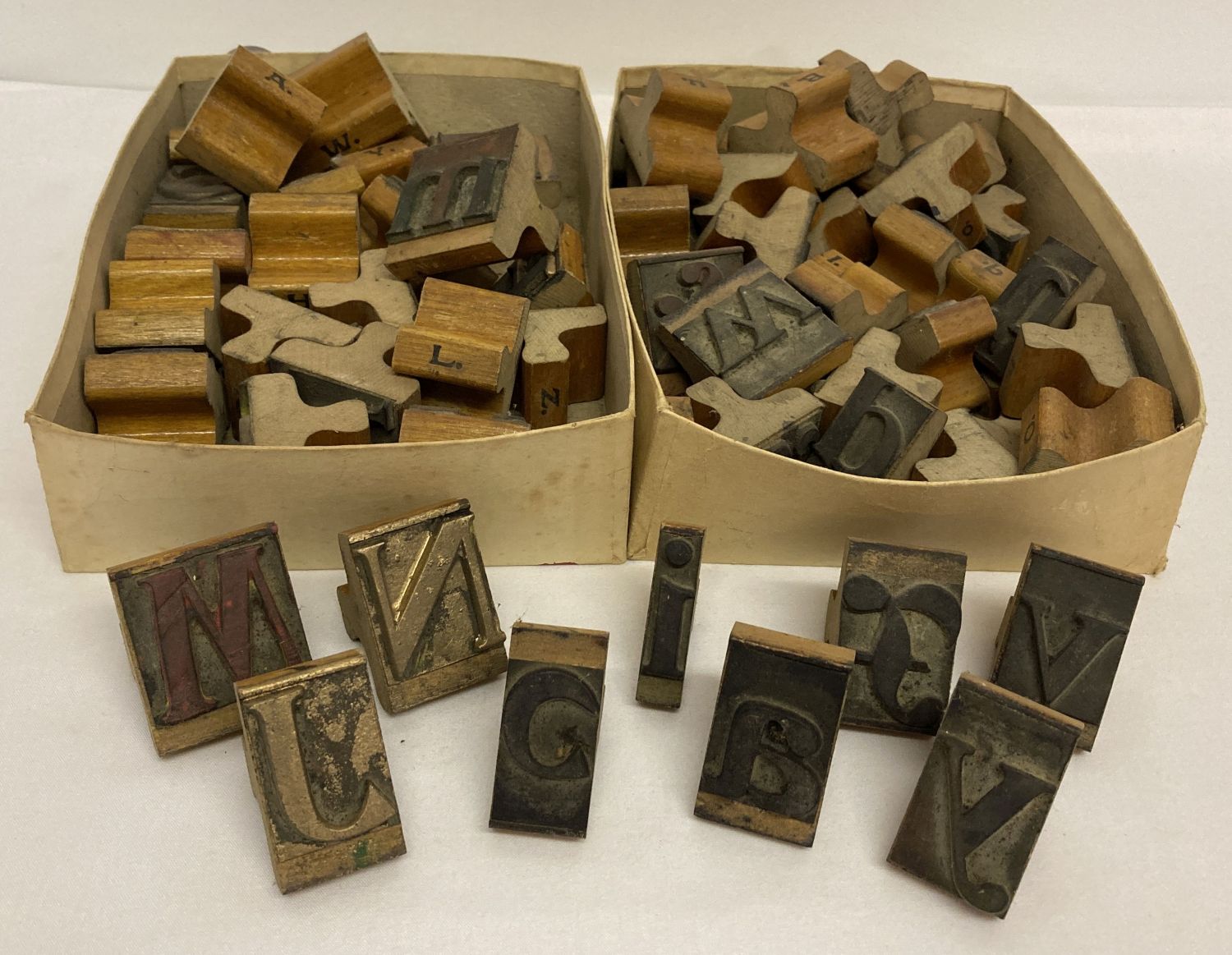 2 boxes of wooden handled letter stamps, lower and upper case.