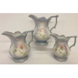 A set of 3 graduating ceramic jugs by Blakeney, in the Victorian pitcher style, with floral detail.