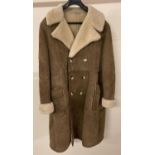 A men's 3/4 length sheepskin suede double breasted winter coat with 6 button fastening.