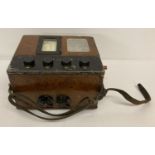 A vintage wooden cased Bridge Ohmmeter meg resistance tester by The Record Electrical Co, Ltd.