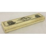 A small Scrimshaw style bone box with hinged lid and carved detail to top.