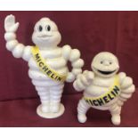 2 painted cast iron money bank figurines of Michelin men.