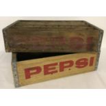 2 vintage wooden Pepsi Cola crates with metal banding; one with individual bottle sections.