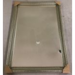 A large modern decorative gilt framed mirror.