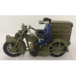 A painted cast iron figurine of a Postman motorcyclist.