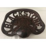 A cast metal Blackstone tractor seat.