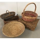 A small collection of 5 wicker and raffia baskets.