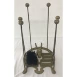 A painted cast metal boot stand, with brush, jack, scraper and boot stands.